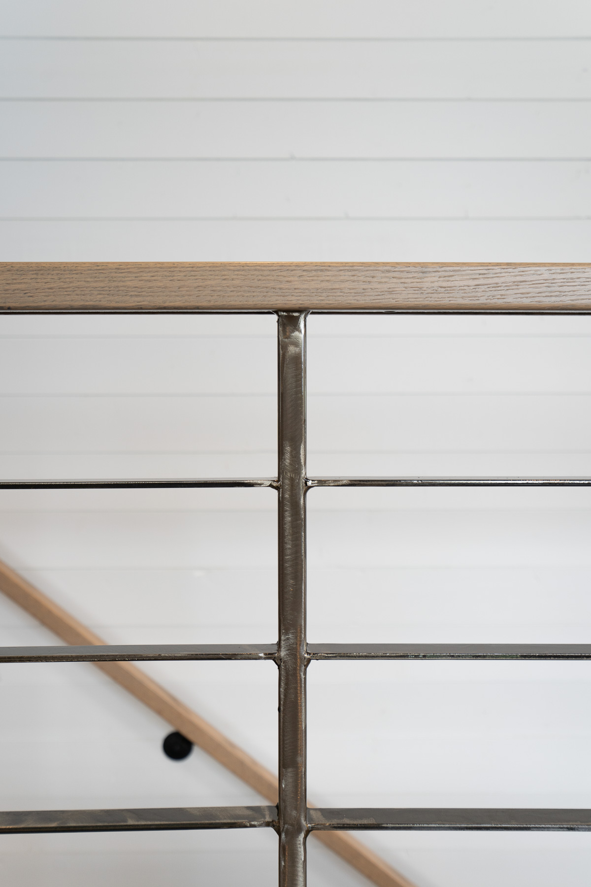 Coquitlam remodel metal spindle detail on stair rails