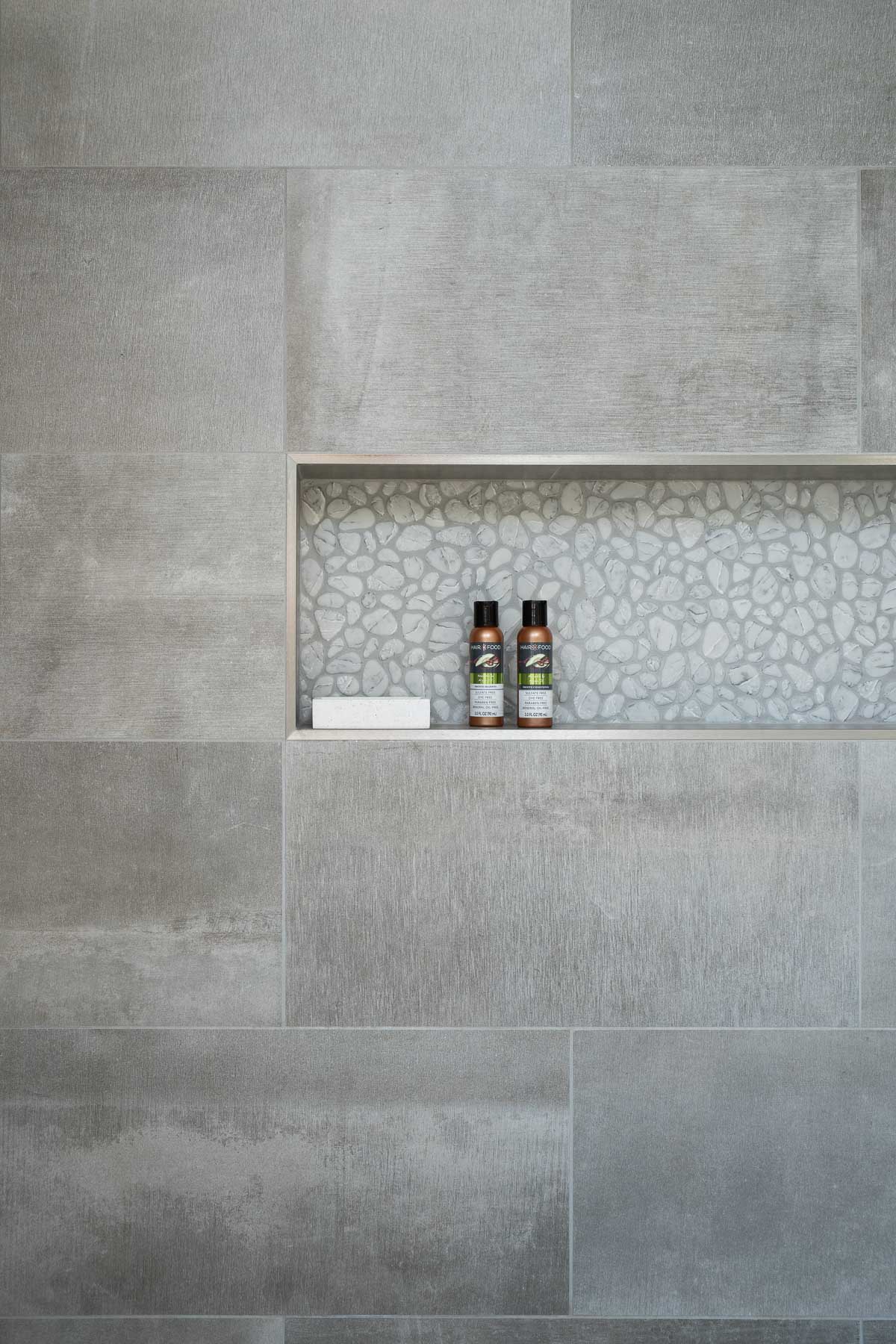 porcelain tiled shower with accent niche