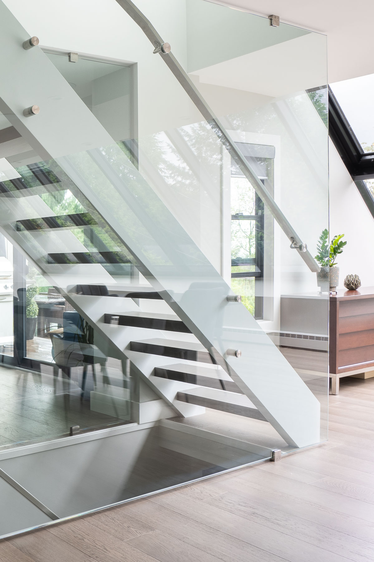 West Van remodel floating staircase in glass